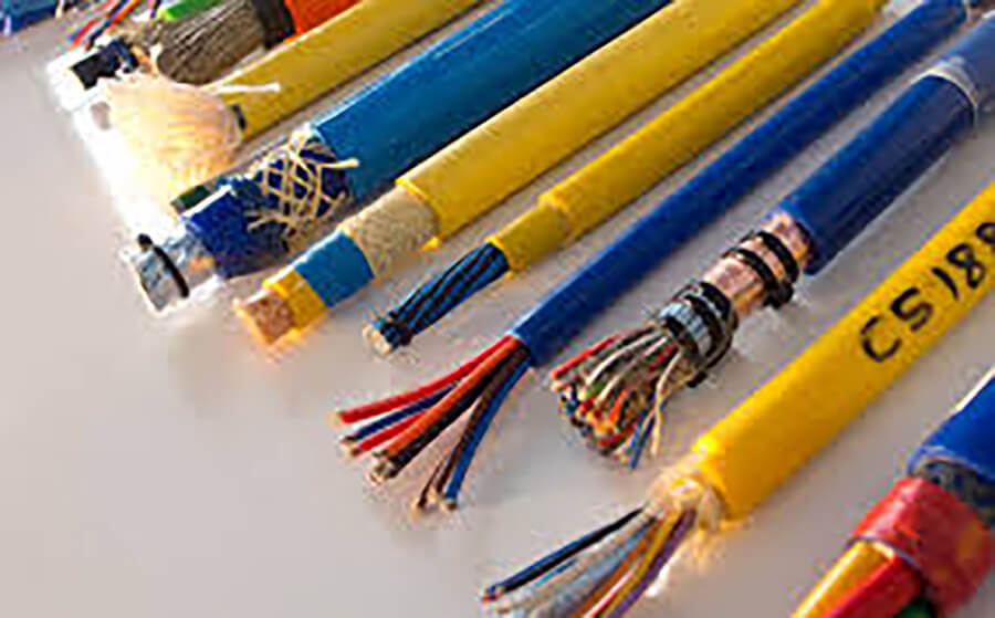 Various colored wires exposed; arranged on a white surface.