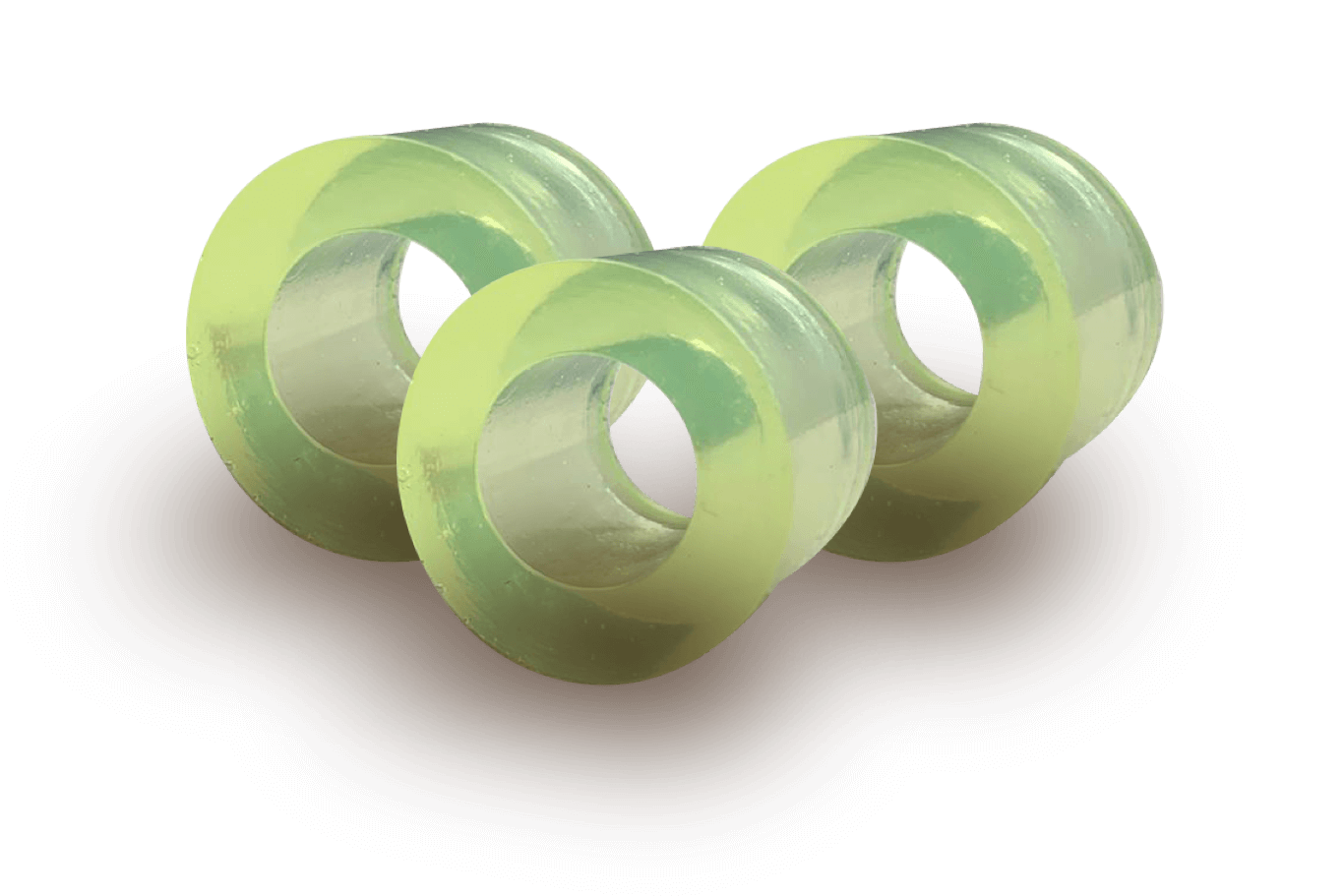 Three translucent green rings arranged on a dark surface.