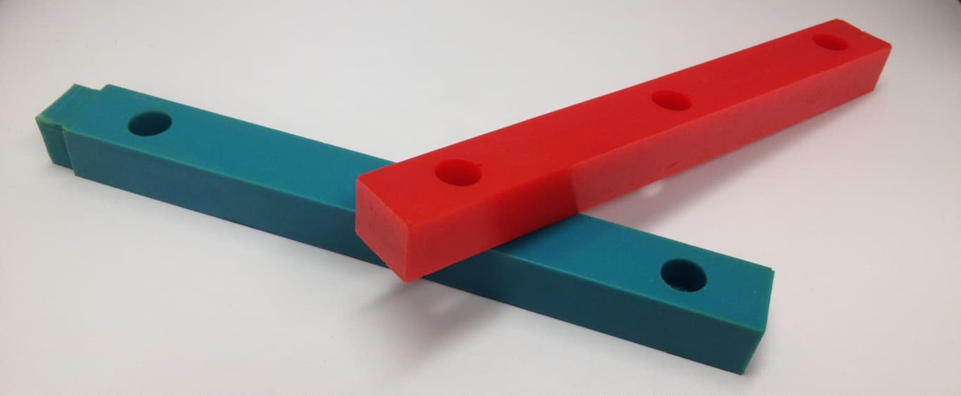 Red and blue rectangular bars intersect on white surface.