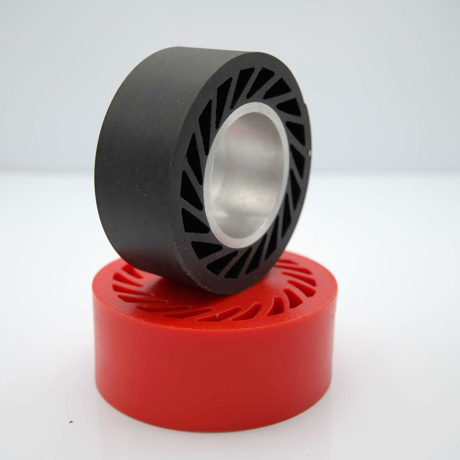 Black and red wheels stacked, white background.